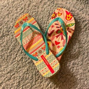 Pink,yellow,blue flip flops size 6